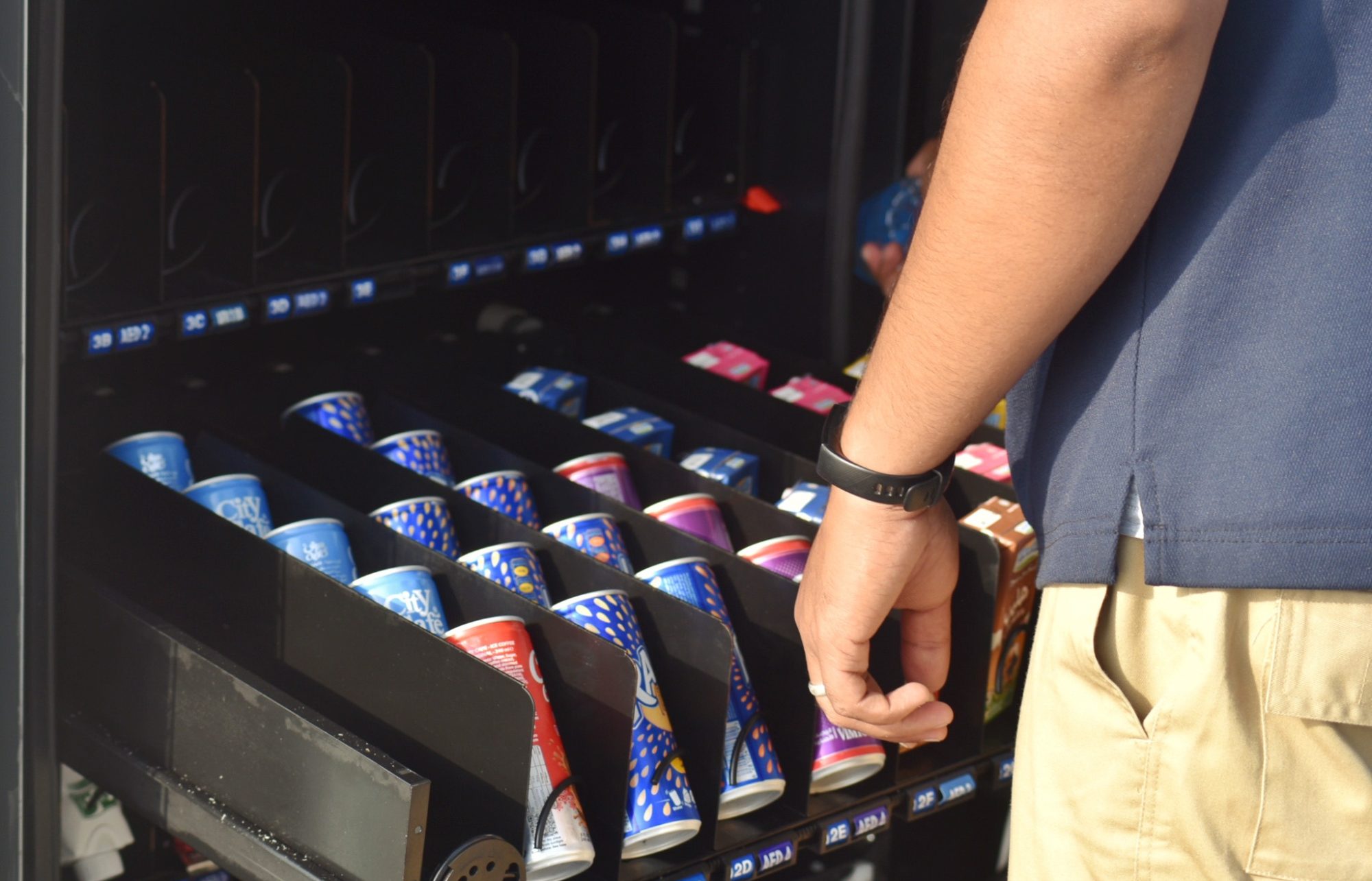 local-snack-vending-machine-being-stocked-by-suppl-2025-03-09-00-08-14-utc-2